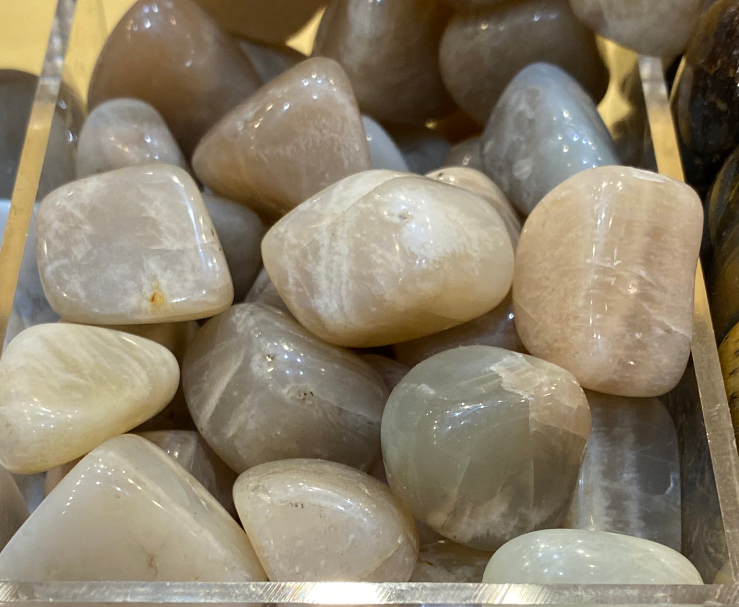 Tumbled Moonstone stones for intuition and safe travel.