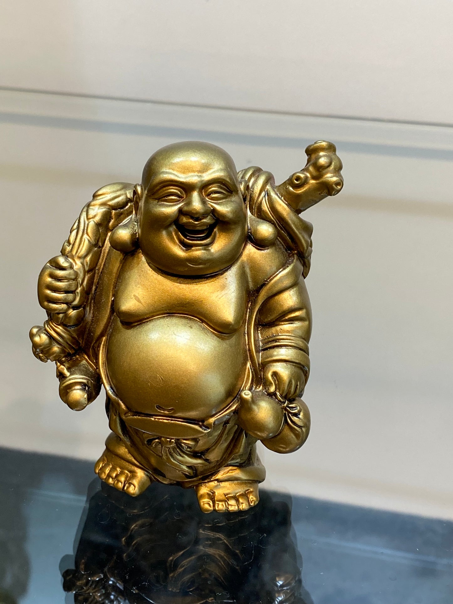 Gold Laughing Standing Buddha holding his bag of plenty and a Bottle Gourd