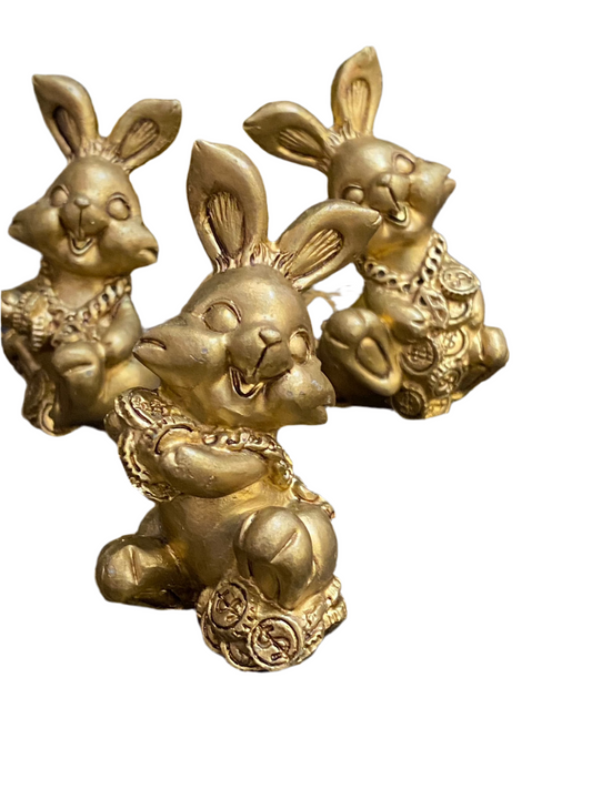 Good Luck Fortune Rabbit figurines symbolizing luck and prosperity.