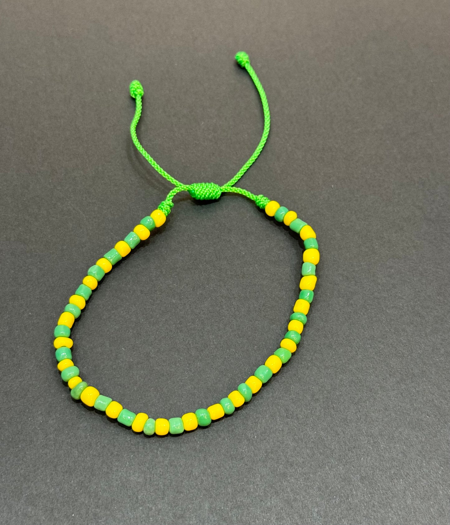 Orisha Orúla Handmade Beaded Pull String Green and Yellow Bracelet