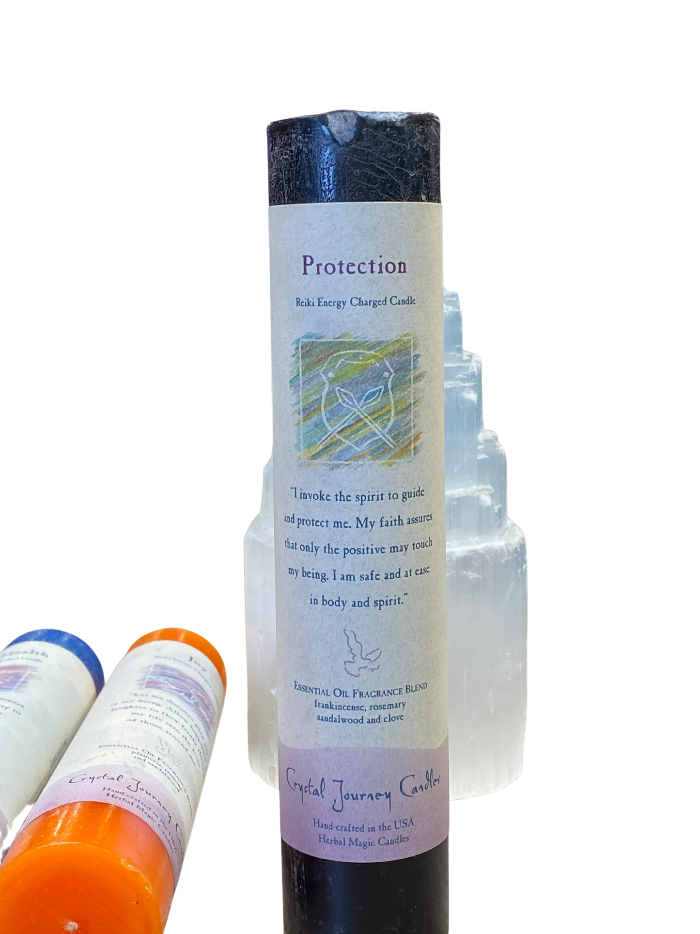 Protection Pillar Candle by Crystal Journey Candles with frankincense, sandalwood, rosemary, and clove.