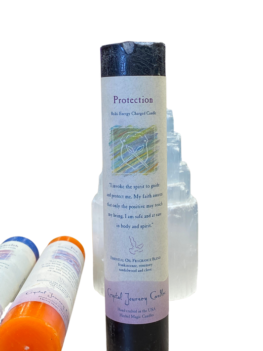 Protection Pillar Candle by Crystal Journey Candles with frankincense, sandalwood, rosemary, and clove.