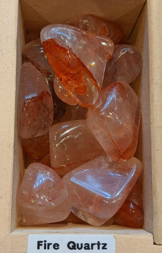 Fire Quartz Crystal tumbled stones in varying colors, quarter size, for grounding and balance.