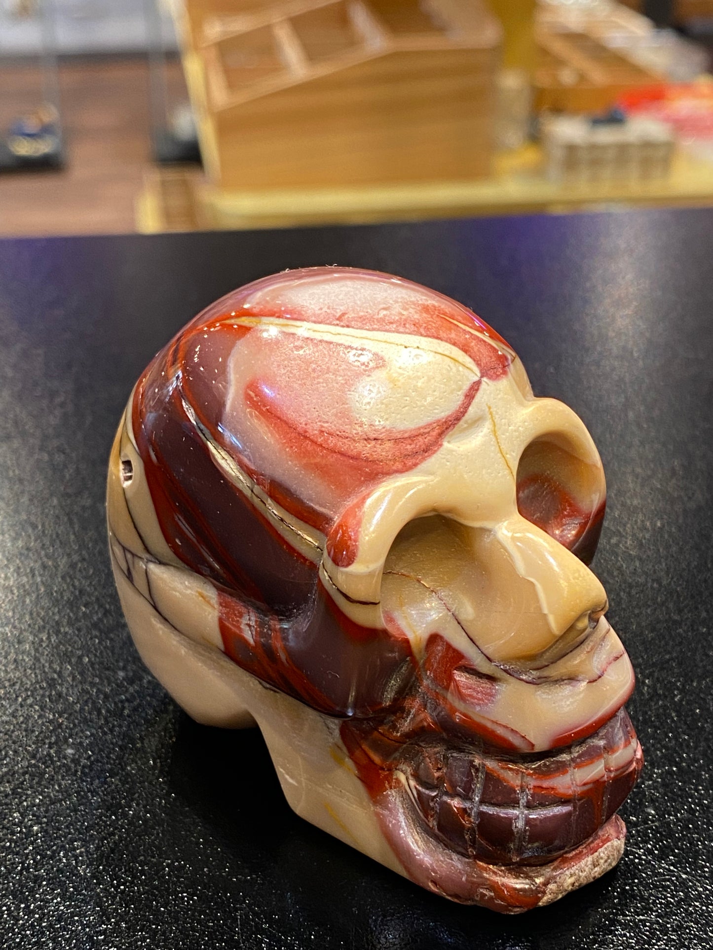 Polished Natural Hand Carved Mookaite Jasper Skull